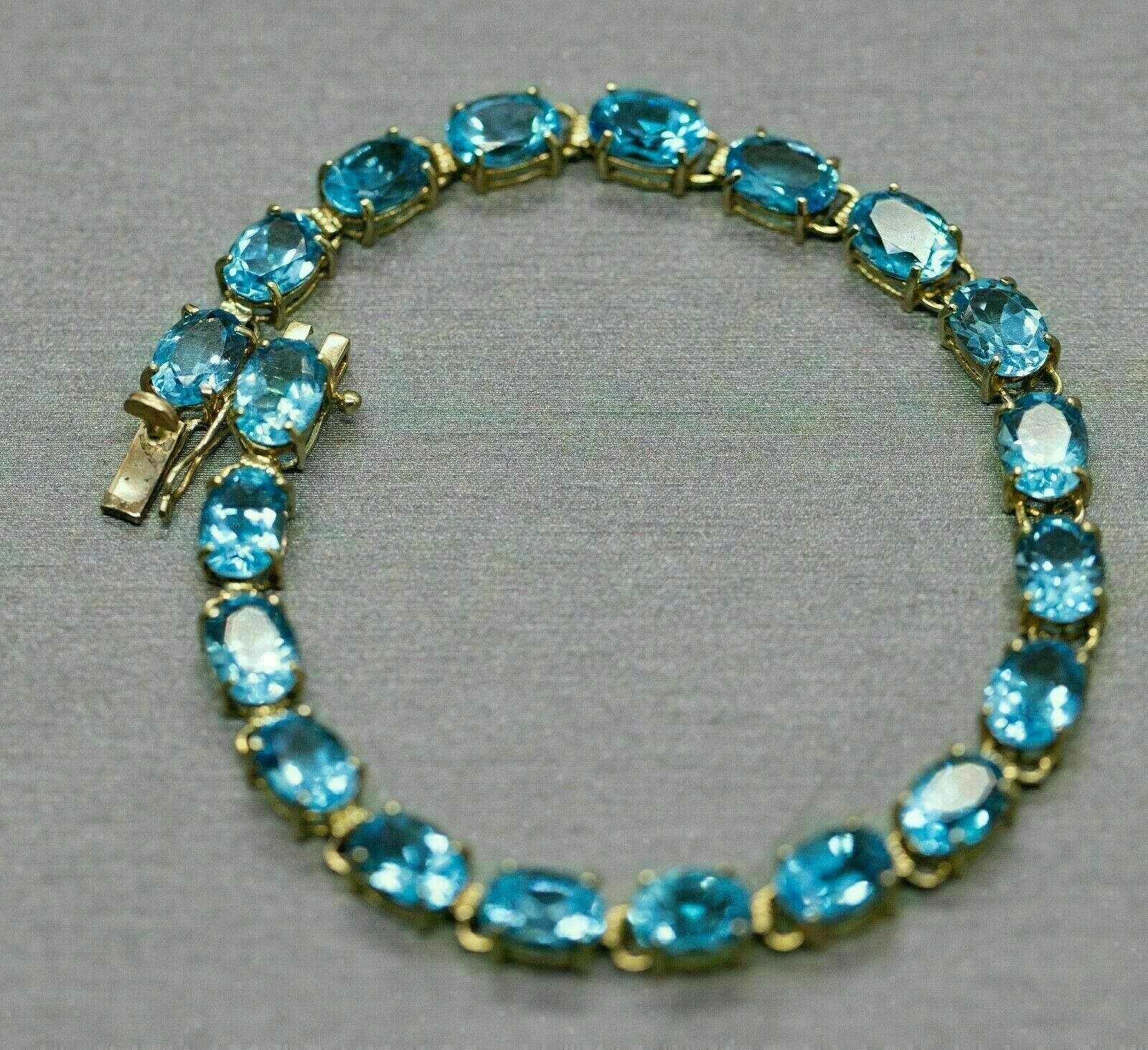 10Ct Brilliant Oval Cut Blue Topaz Women's Tennis Bracelet 14K Yellow Gold Over