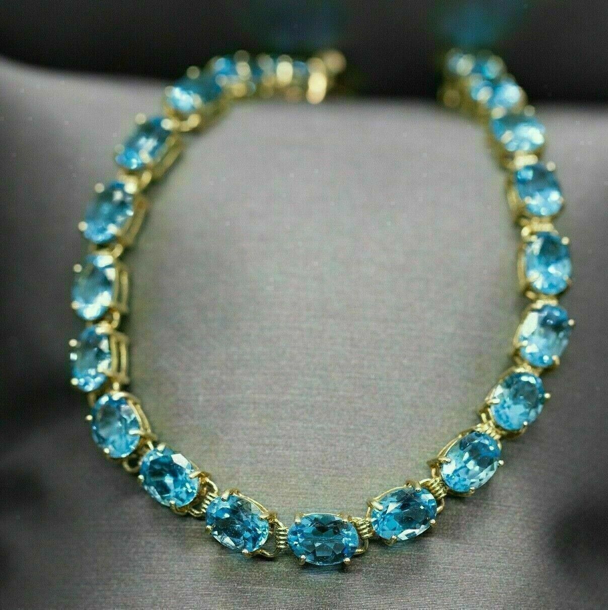 10Ct Brilliant Oval Cut Blue Topaz Women's Tennis Bracelet 14K Yellow Gold Over